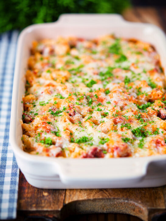 Corned beef and tomato macaroni pasta bake with a cheesy topping.