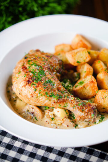 Somerset chicken legs in a creamy cider and cheddar sauce served with mini roast potatoes.