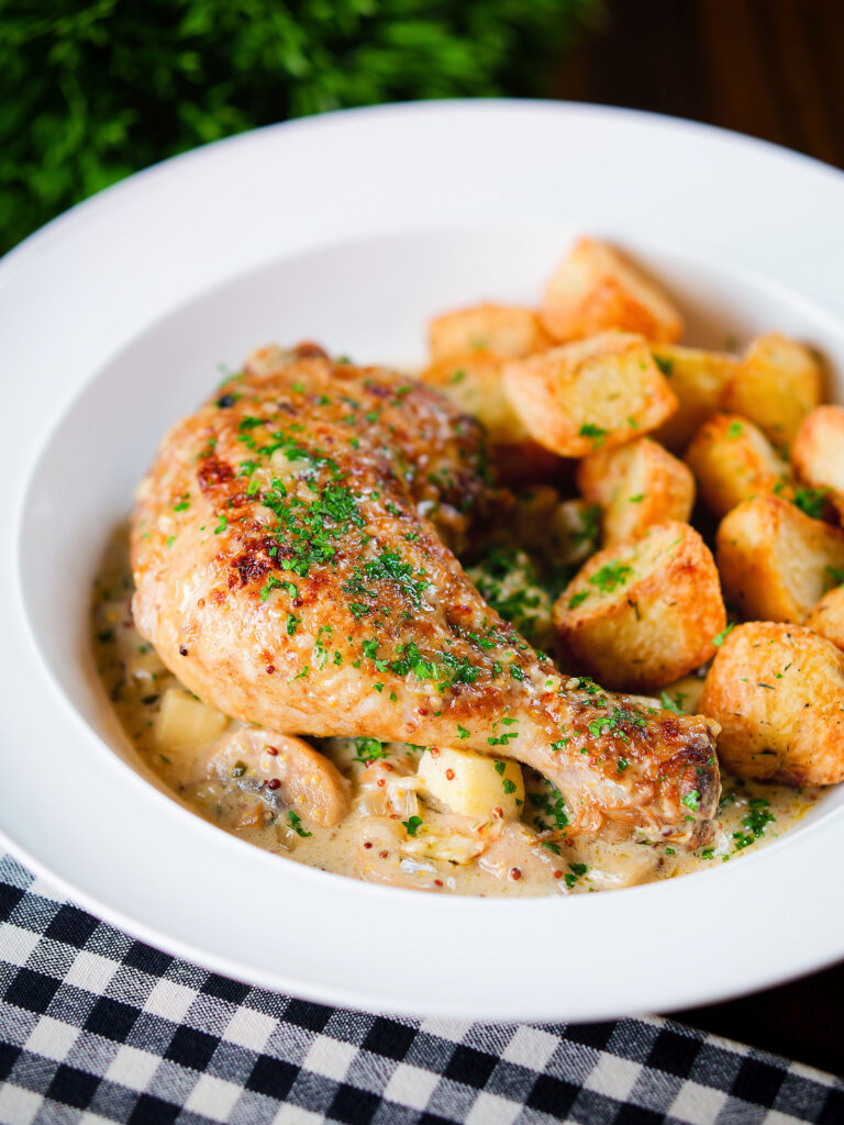 Somerset chicken legs in a creamy cider and cheddar sauce served with mini roast potatoes.