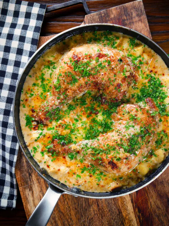 Overhead Somerset chicken cooked in a cider, cheddar cheese and cream sauce served in a pan.