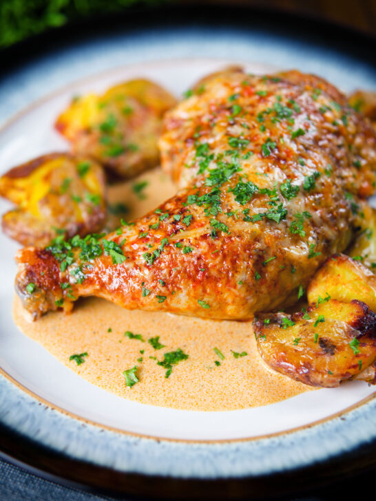 Dijon chicken leg or poulet Gaston Gerard served with roasted crushed new potatoes.