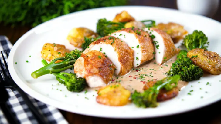 Chicken breast (roasted on the crown) in peppercorn sauce, smashed potatoes and broccoli.