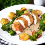 Chicken breast (roasted on the bone) in peppercorn sauce, smashed potatoes and broccoli.
