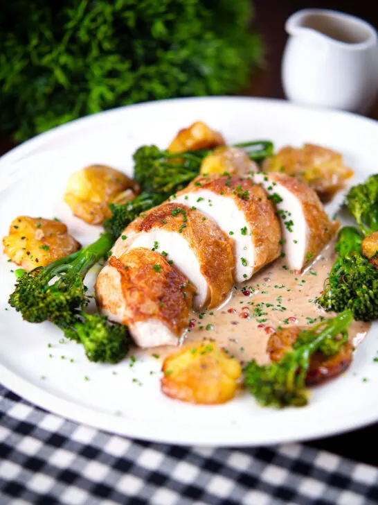 Chicken breast (roasted on the bone) in peppercorn sauce, smashed potatoes and broccoli.