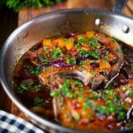 Roasted mango chutney pork chops in a cooking pan.