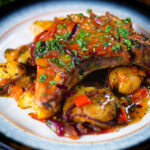 Spicy roasted mango chutney pork chops with Indian influenced roasted Bombay potatoes.