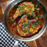 Overhead roasted mango chutney pork chops in a cooking pan.