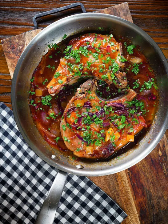 Overhead roasted mango chutney pork chops in a cooking pan.
