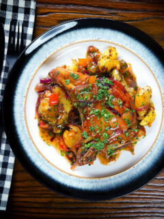 Overhead spicy roasted mango chutney pork chops with Indian influenced roasted Bombay potatoes.