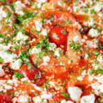 Close-up Greek prawn (shrimp) saganaki with feta cheese.