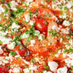 Close-up Greek prawn (shrimp) saganaki with feta cheese.
