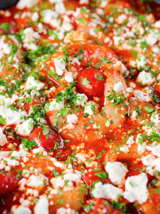 Close-up Greek prawn (shrimp) saganaki with feta cheese.