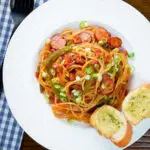 Overhead Japanese spaghetti napolitan a tomato ketchup pasta with sausage and bacon.
