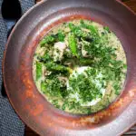 Overhead herby Thai green pork curry with sugar snap peas and jasmine rice.