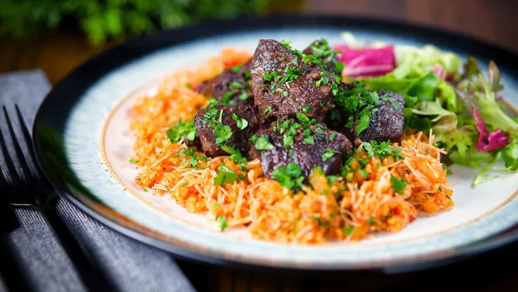 Cypriot Afelia, pork shoulder braised in red wine and coriander seeds served with pourgouri.