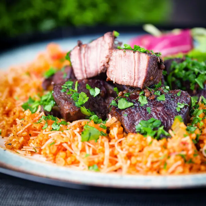 Cypriot Afelia, pork shoulder braised in red wine and coriander seeds served with pourgouri.