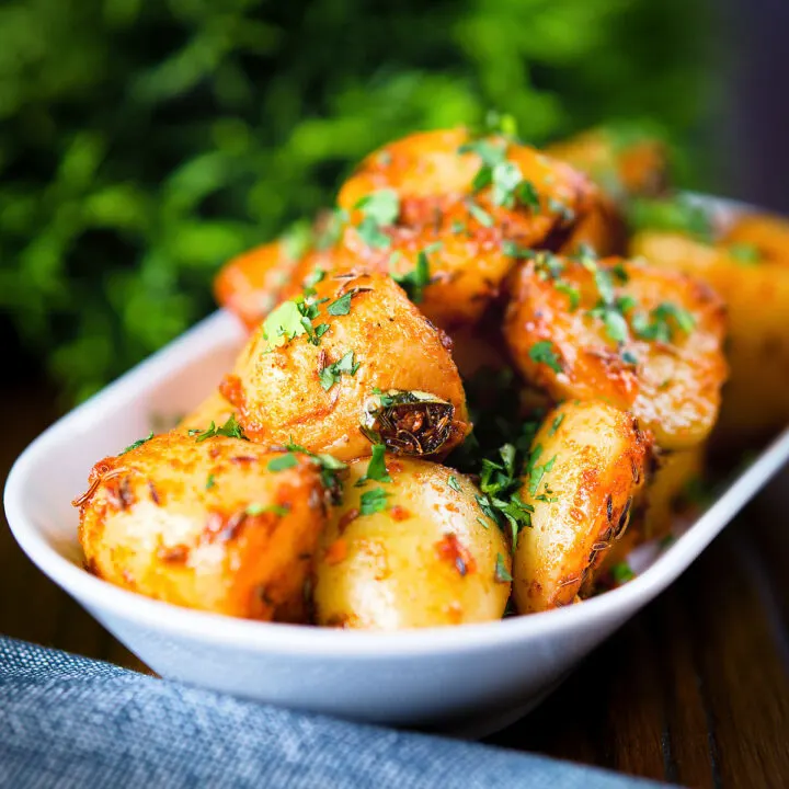 Spicy Indian aloo jeera (cumin potatoes) with fresh coriander.