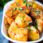Overhead aloo jeera (Indian spiced cumin potatoes) garnished with fresh coriander.