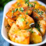 Overhead aloo jeera (Indian spiced cumin potatoes) garnished with fresh coriander.
