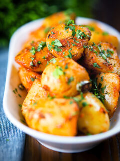 Overhead aloo jeera (Indian spiced cumin potatoes) garnished with fresh coriander.