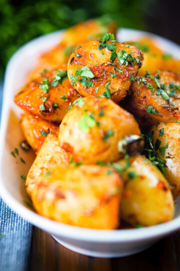 Overhead aloo jeera (Indian spiced cumin potatoes) garnished with fresh coriander.