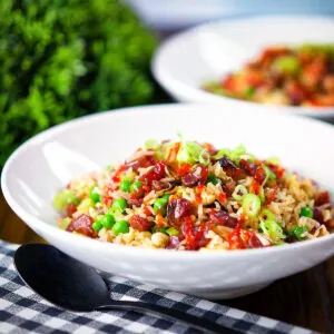 Chinese sausage (lap cheong) and egg fried rice with sweet green peas and spring onion.