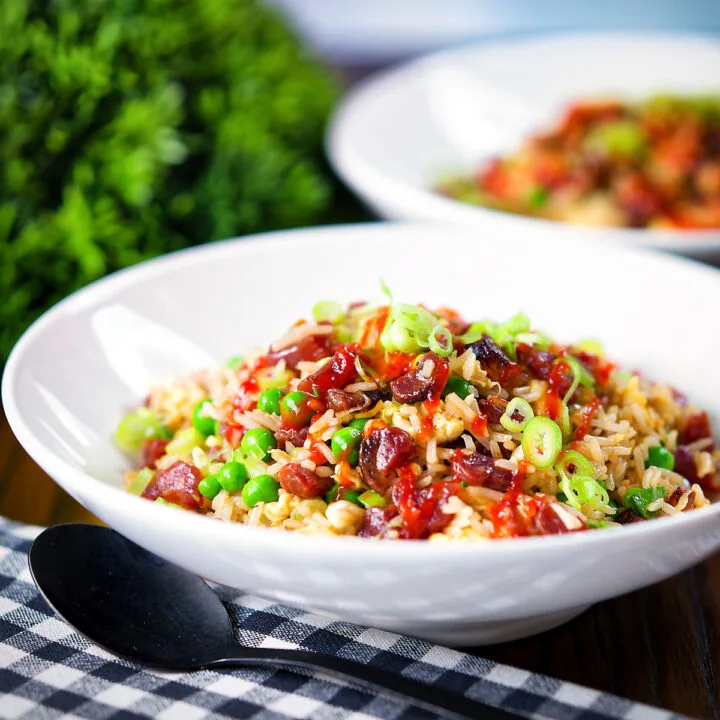 Chinese sausage (lap cheong) and egg fried rice with sweet green peas and spring onion.