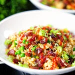 Chinese sausage (lap cheong) and egg fried rice with garden peas and spring onion.
