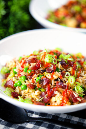 Chinese sausage (lap cheong) and egg fried rice with garden peas and spring onion.