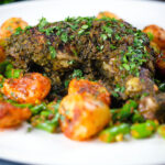 Close-up Goan (Indian) Chicken Cafreal served with aloo jeera and green bean poriyal.