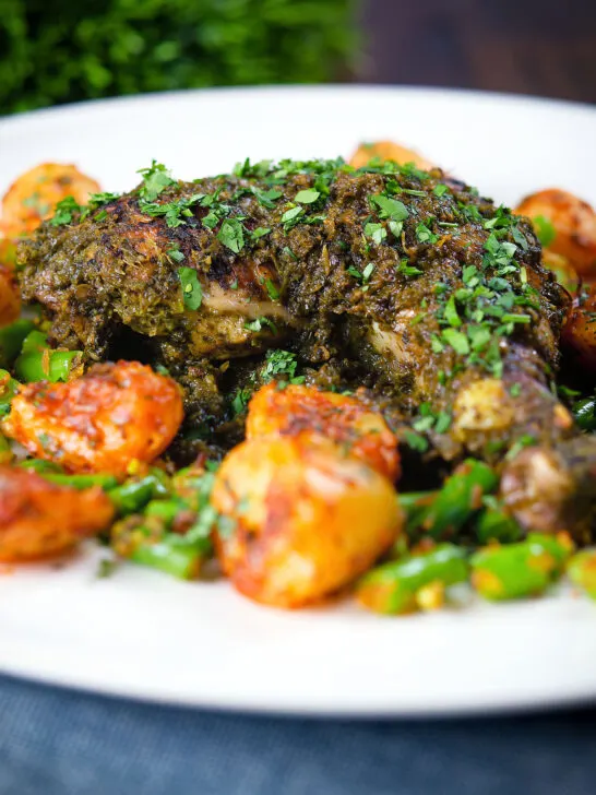 Close-up Goan (Indian) Chicken Cafreal served with aloo jeera and green bean poriyal.