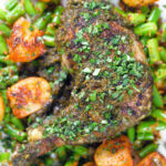 Overhead close-up Goan (Indian) Chicken Cafreal served with aloo jeera and green bean poriyal.
