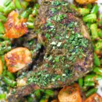 Overhead close-up Goan (Indian) Chicken Cafreal served with aloo jeera and green bean poriyal.
