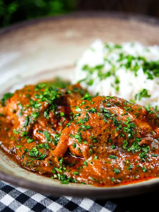 Goan chicken xacuti curry served with white rice and fresh coriander.