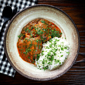 Goan chicken xacuti curry served with basmati rice and fresh coriander.