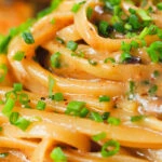 Miso butter pasta with pecorino, black & pink peppercorns and chives.