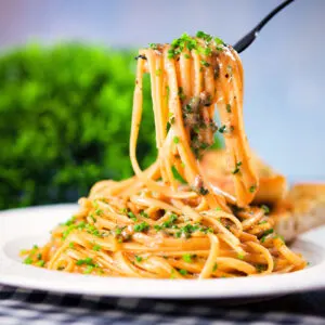 Miso butter pasta with black & pink peppercorns and snipped chives served with garlic bread.