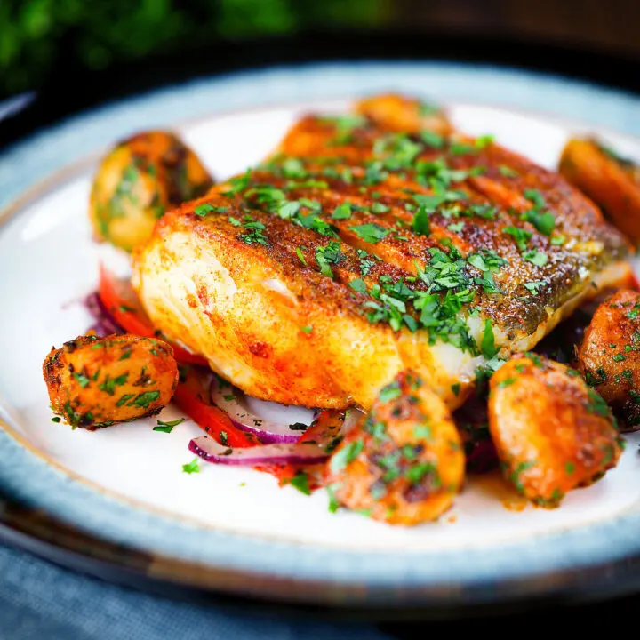 Pan fried curried cod fillet with aloo jeera and tomato and onion salad.