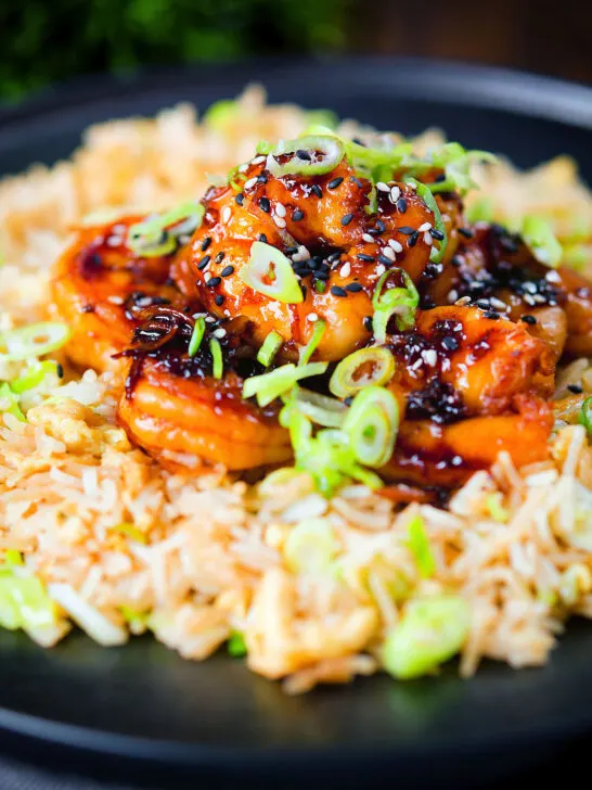 Teriyaki king prawns (shrimp) stir fry served with egg fried rice.