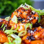Close-up Teriyaki king prawns (shrimp) stir fry served with egg fried rice.