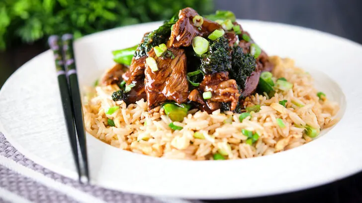 Quick and easy beef (steak) and broccoli stir fry served with egg fried rice.