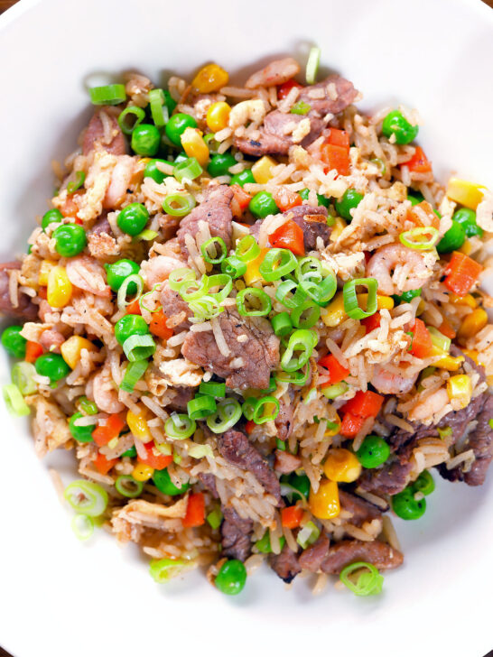 Overhead close-up Chinese takeaway style special fried rice with beef, pork, chicken and prawns.