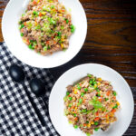 Overhead Chinese takeaway style special fried rice with beef, pork, chicken and prawns.