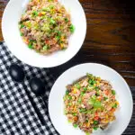 Overhead Chinese takeaway style special fried rice with beef, pork, chicken and prawns.