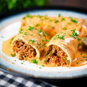 Hortobágyi palacsinta Hungarian Meat (minced beef) stuffed pancakes in a sour cream and paprika sauce.