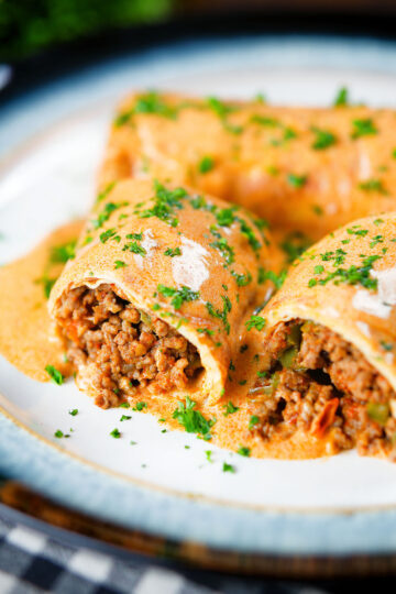 Hortobágyi palacsinta Hungarian meat stuffed pancakes in a sour cream and paprika sauce.
