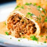 Hortobágyi palacsinta Hungarian minced meat stuffed pancakes in a sour cream and paprika sauce.