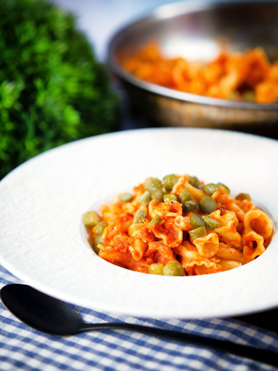 Hungarian potato and paprika pasta (Krumplis Teszta) served with pickles.