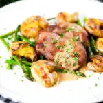 Pan fried pork tenderloin medallions with a cider, mustard and camembert sauce, new potatoes and asparagus.