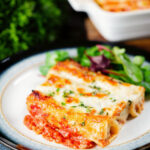Baked three cheese, pork sausage, leek and ricotta stuffed cannelloni served with a side salad.